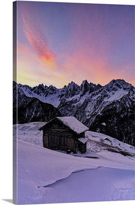 Lone Mountain Hut In Deep Snow With Majestic Peaks In The Background, Switzerland