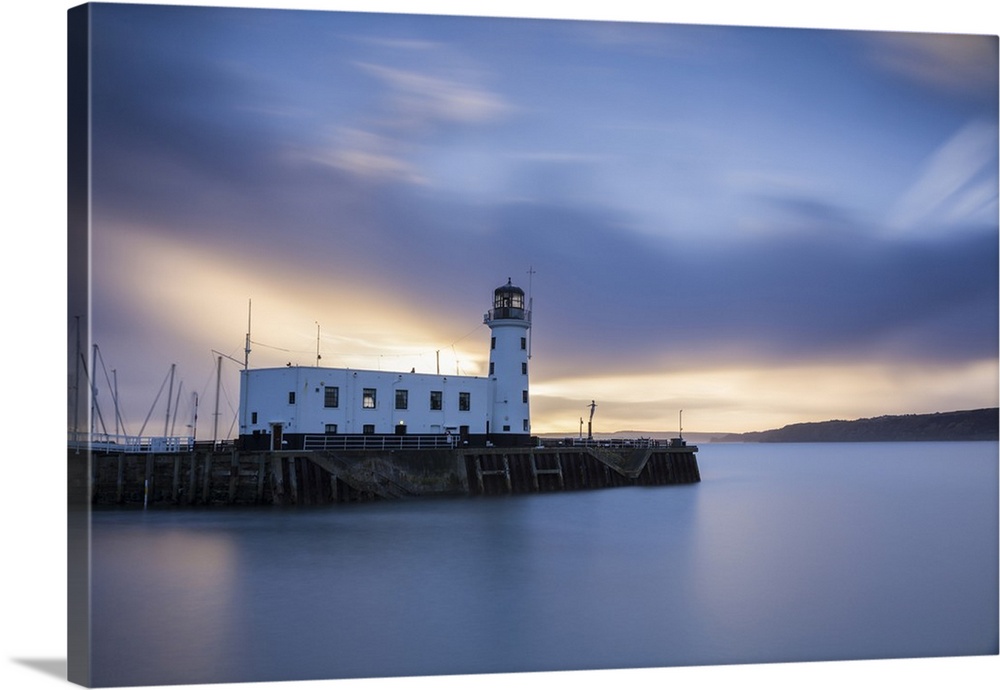 A long exposure photograph of Scarborough Lighthouse shortly after sunrise, Scarborough, North Yorkshire, Yorkshire, England