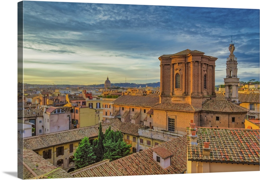 Rooftops landscape panorama with low-rise buildings and Basilica di Sant'Andrea delle Fratte at golden hour elevated view,...