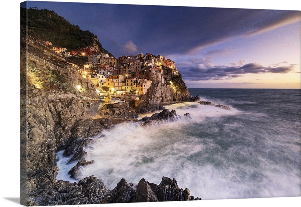 Magical light envelops the famous village of Manarola during an autumn sunset, Manarola, Cinque Terre National Park, UNESC...