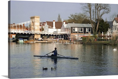 Man rowing on River Thames near Rowing Club, Marlow, England