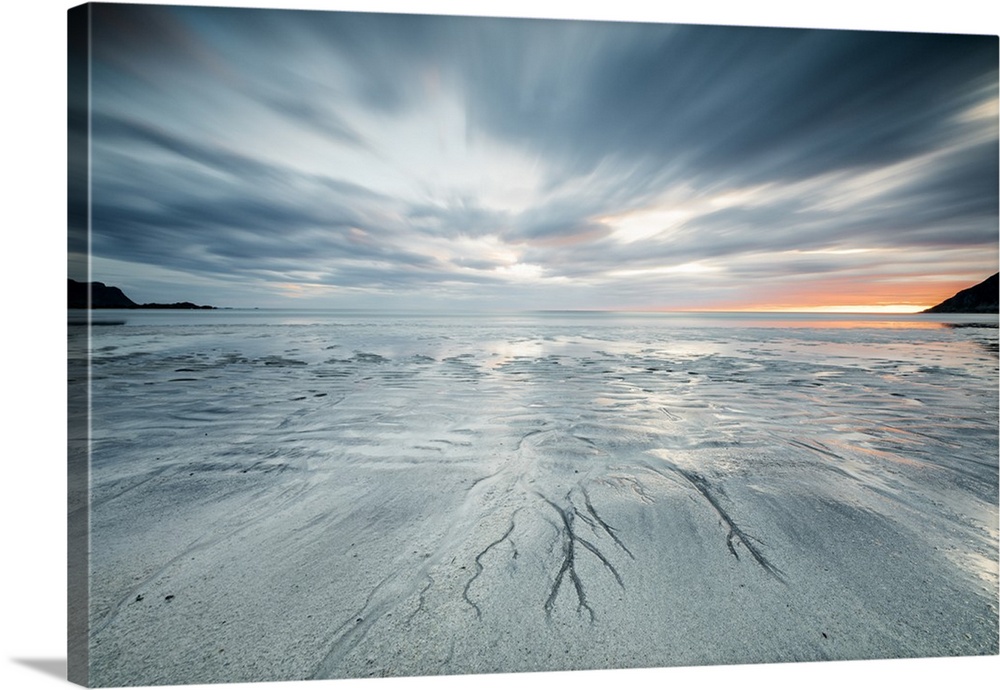 Midnight sun and clouds frame the sandy beach of Skagsanden, Flakstad, Nordland county, Lofoten Islands, Norway, Scandinav...