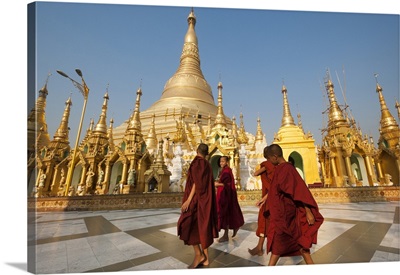 Monks walk around Shwedagon Pagoda, Yangon, Myanmar
