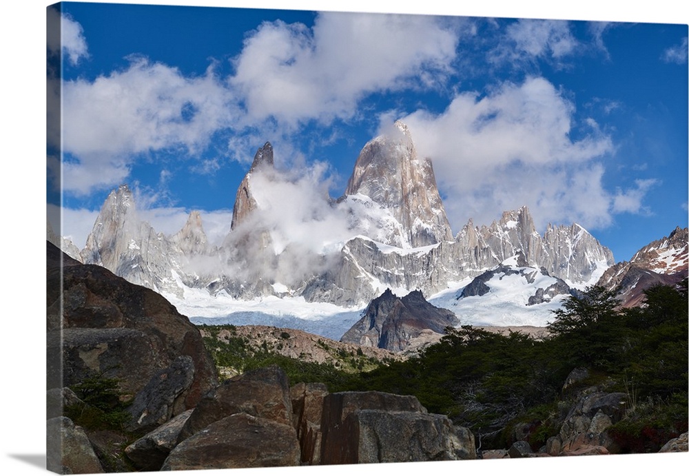 Monte Fitz Roy framed by rocks and trees near Arroyo del Salto in Patagonia, Argentina, South America
