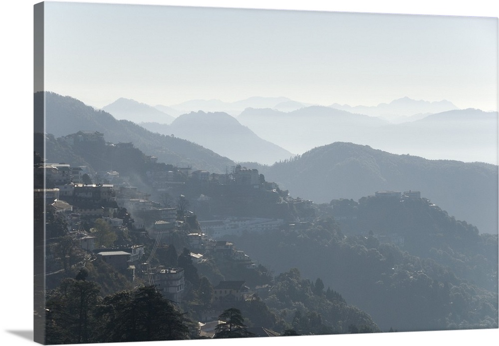 View south from Mussoorie over morning mist on foothills of Garwhal Himalaya, Uttarakhand, India, Asia.
