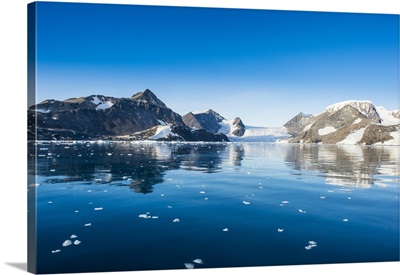 Mountains reflecting in glassy water of Hope Bay, Antarctica