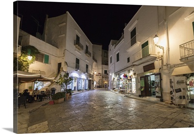 Night view of the alleys of the medieval old town, Ostuni, Apulia, Italy