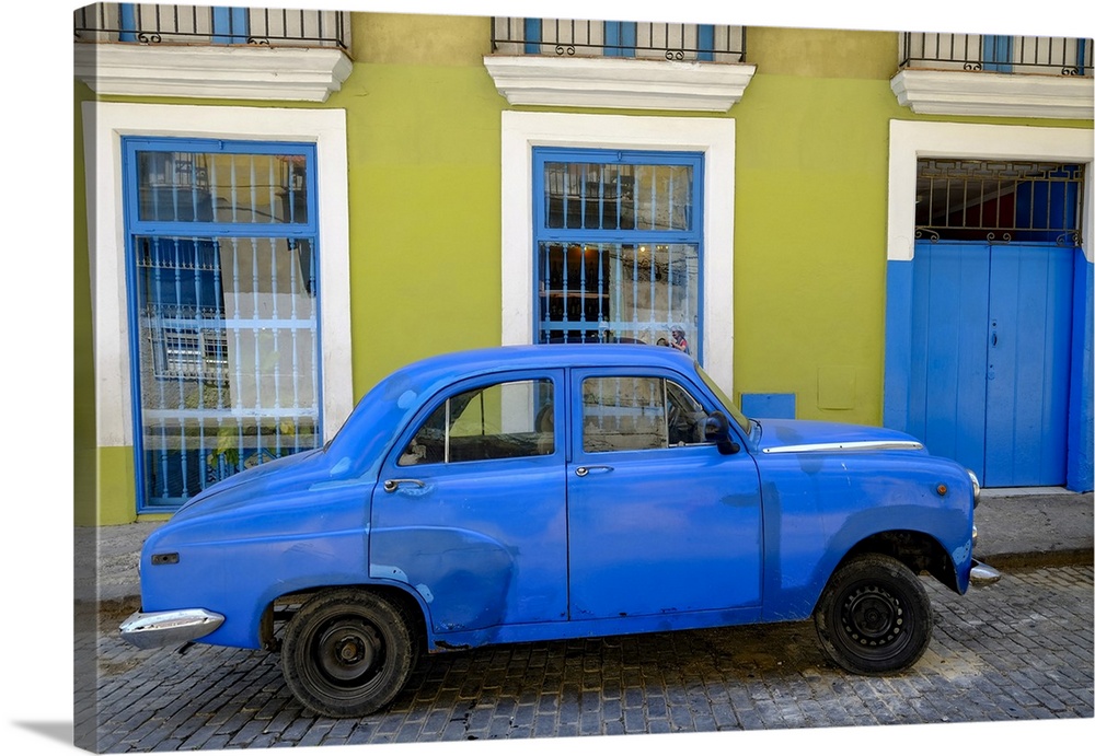 Old car parked in front of a colorful building, Old Havana, Cuba, West Indies, Central America
