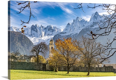 Old Church Lit By Autumn Colors With Snowcapped Piz Badile And Cengalo, Switzerland