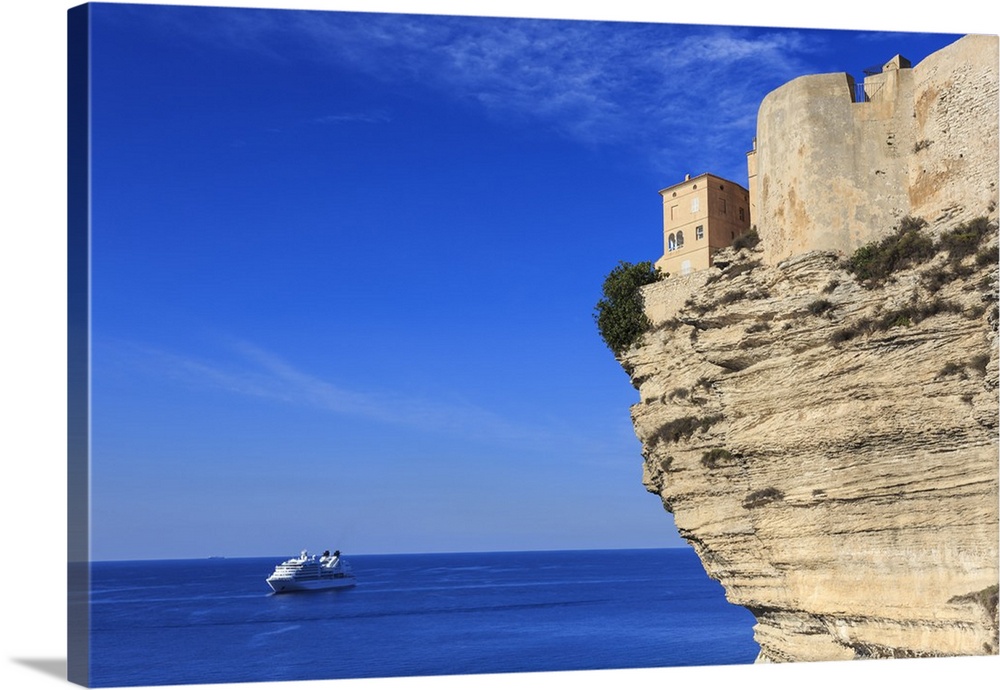 Old citadel atop cliffs with cruise ship anchored off shore, Bonifacio, Corsica, France, Mediterranean, Europe