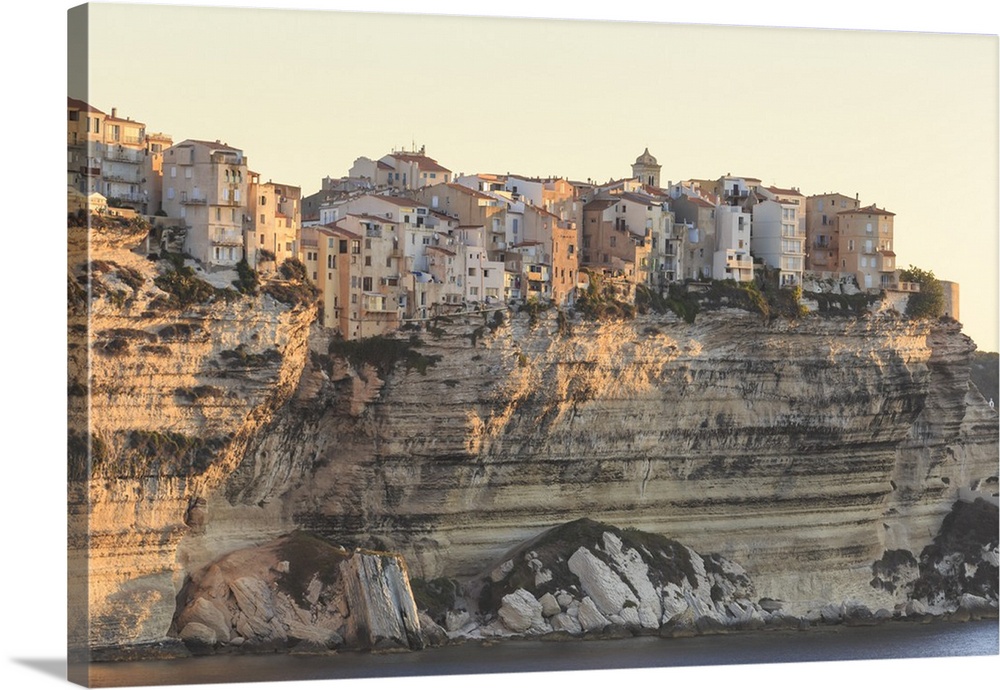 Old citadel townhouses and church at dawn, in early morning light, seen from the sea, Bonifacio, Corsica, France, Mediterr...