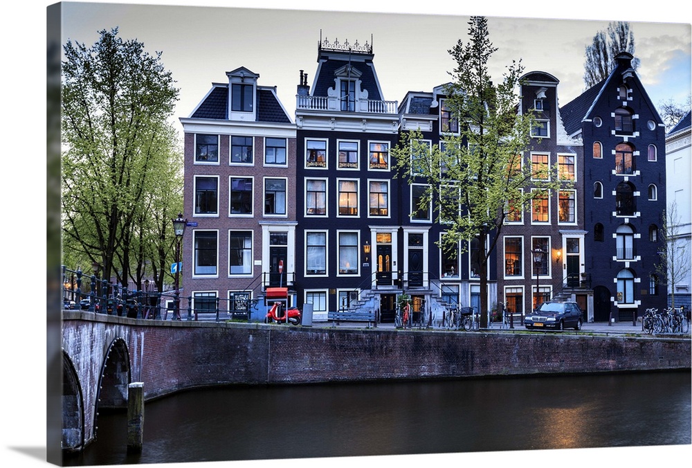 Old gabled houses line the Keizersgracht canal at dusk, Amsterdam, Netherlands, Europe.