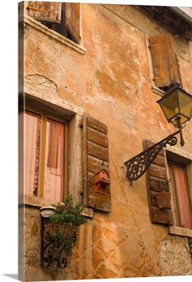 Old wall with shuttered windows, Lazise, Lake Garda, Veneto, Italy