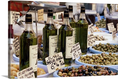 Olives and olive oil on sale at a market, Cassis, Provence-Alpes-Cote-d'Azur, France
