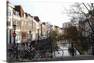On the Catharijnsingel, bicycles stand on a bridge over a canal in Utrecht, Netherlands