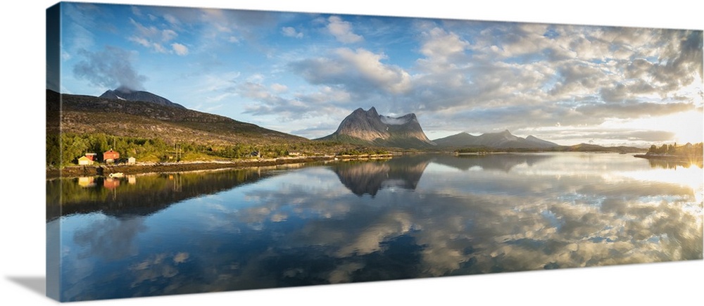 Panorama of pink clouds reflected in the clear blue sea at midnight sun, Anepollen Fjord, Nordland, Norway, Scandinavia