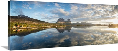 Panorama of pink clouds reflected in the blue sea at midnight sun, Norway, Scandinavia