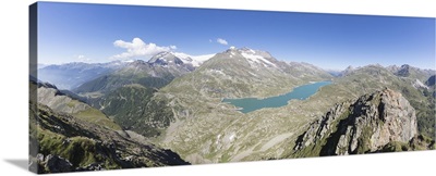 Panorama of the blue Lago Bianco surrounded by high peaks, Swiss Alps