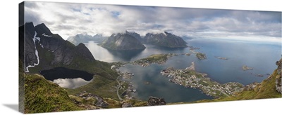 Panorama of the blue lake and sea framed by rocky peaks