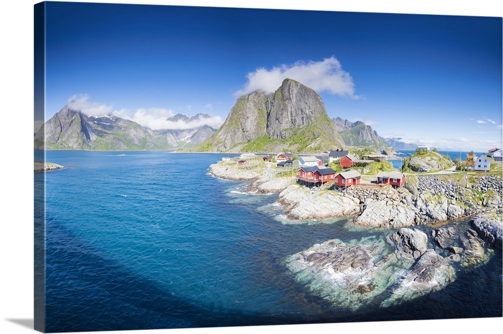 Panorama of the fishing village framed by blue sea and high peaks, Hamnoy, Moskenesoya, Nordland county, Lofoten Islands, ...