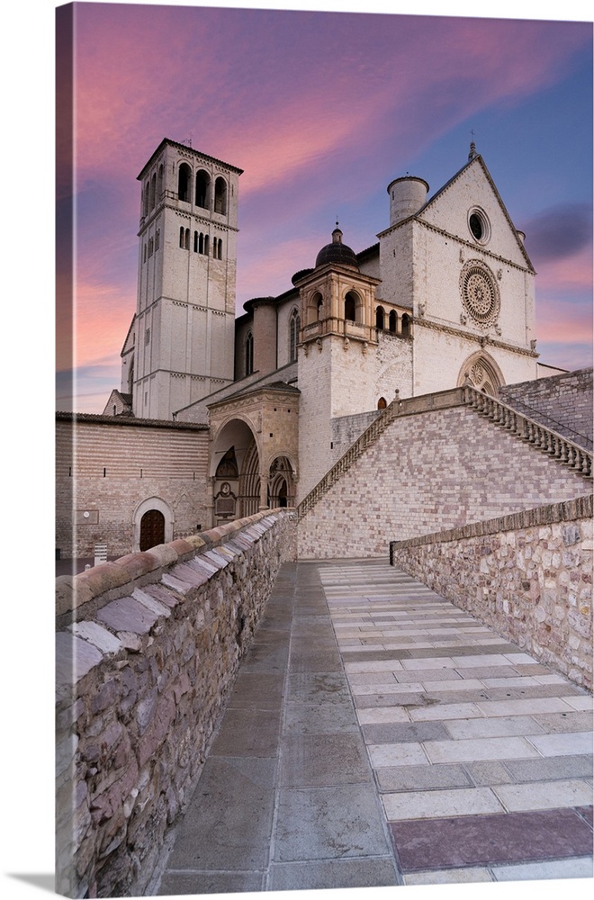 Pink sunrise over the Papal Basilica of Saint Francis in Assisi, UNESCO World Heritage Site, Perugia province, Umbria, Ita...