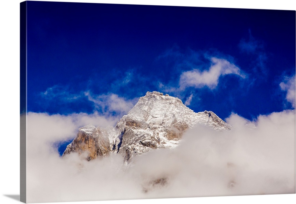 Peak of Mount Everest peeking through the clouds, Sagarmartha National Park, Himalayas, Nepal