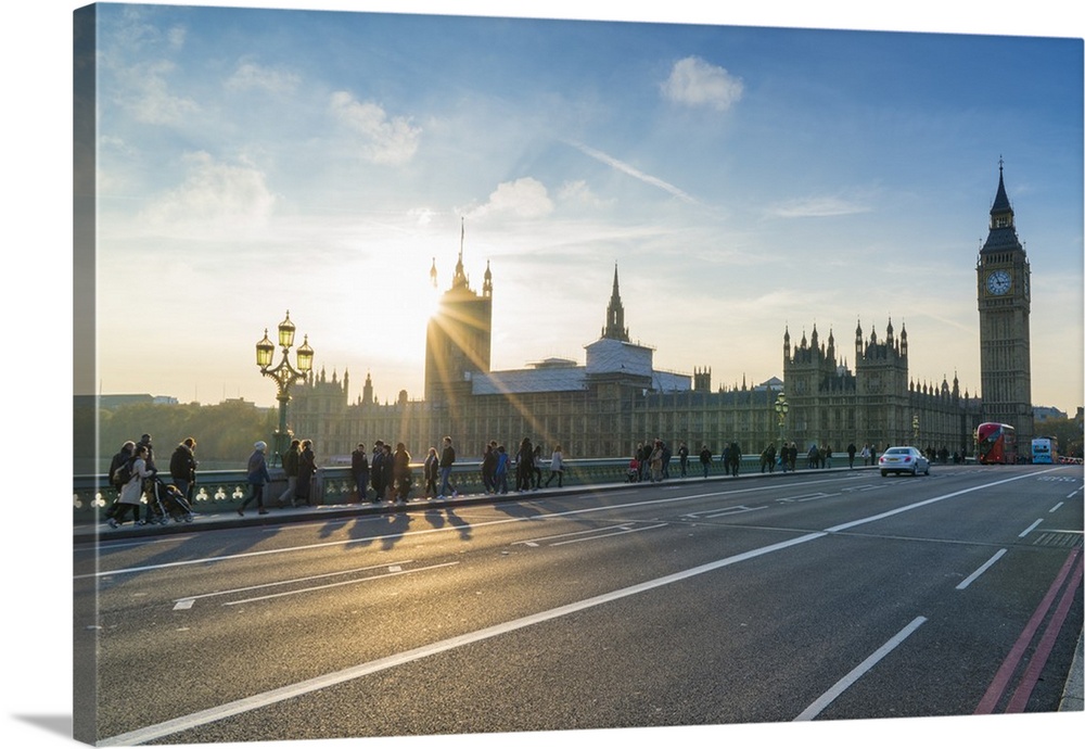 Pedestrians on Westminster Bridge with Houses of Parliament and Big Ben at sunset, London, England, United Kingdom, Europe