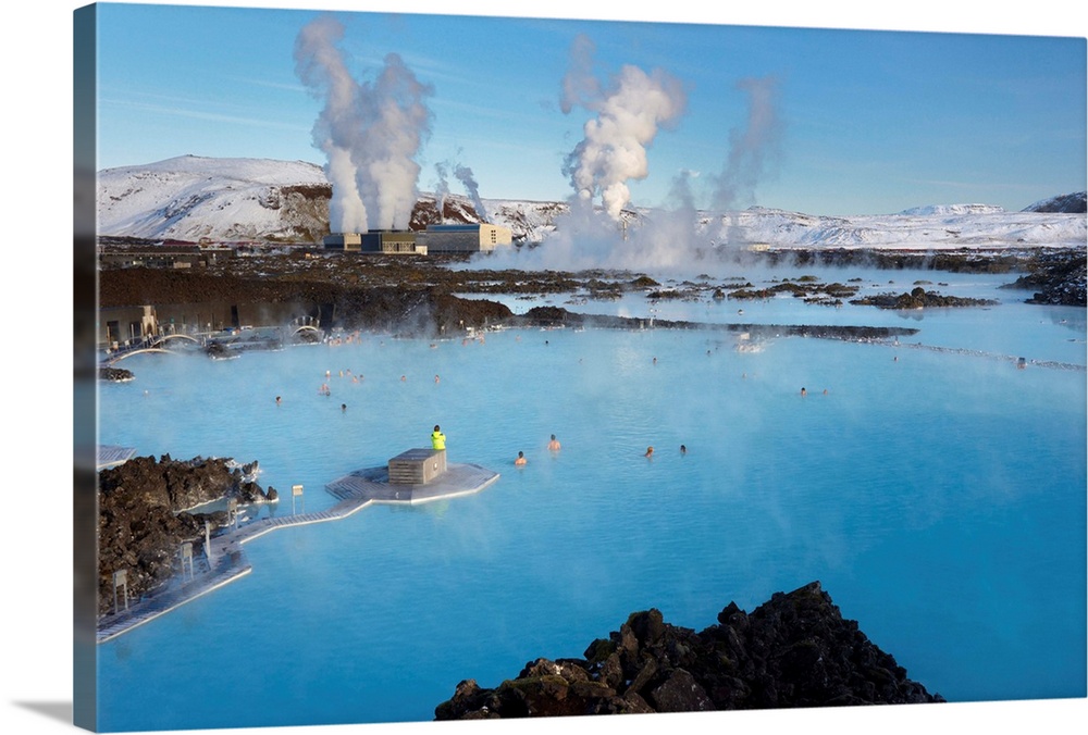 People relaxing in Blue Lagoon geothermal spa, Svartsengi Geothermal Power Station in the distance, Grindavik, Reykjanes P...