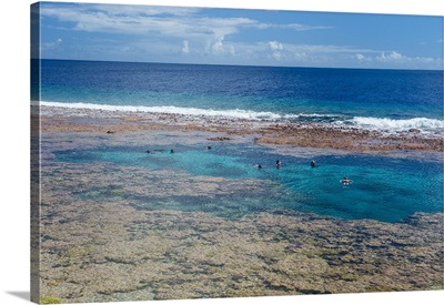 People swimming in the amazing Limu low tide pools, Niue
