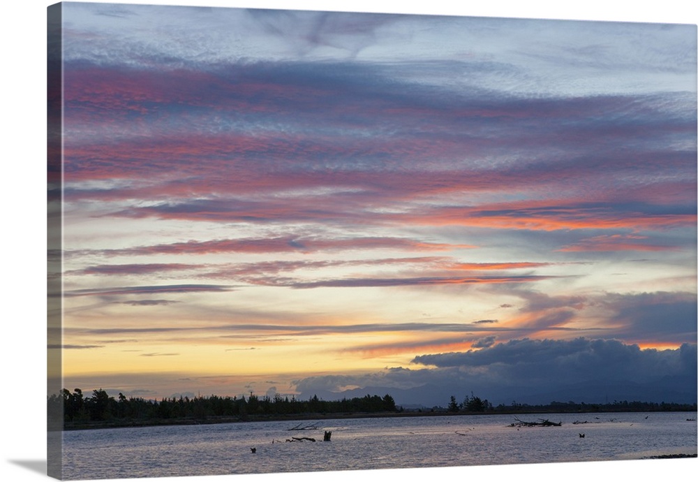 Pink clouds over the Wairau River estuary at dusk, Wairau Bar, near Blenheim, Marlborough, South Island, New Zealand, Pacific