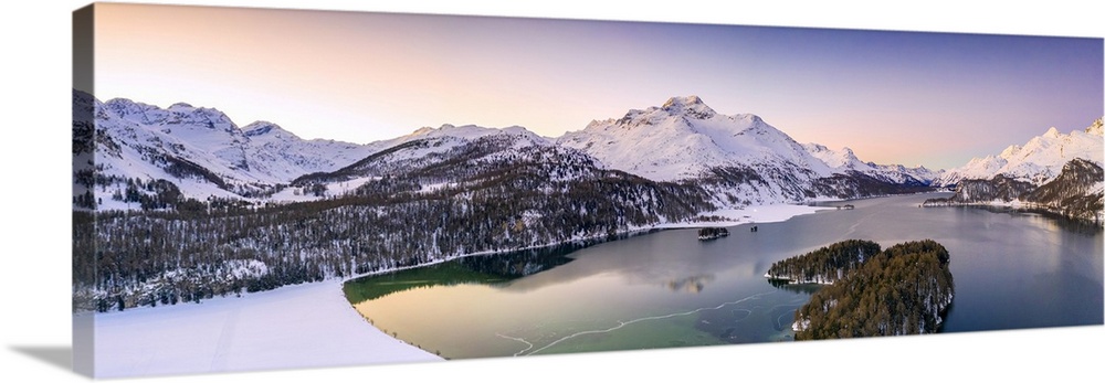 Aerial panoramic of Piz Da La Margna and Lake Sils during a winter sunrise, Engadine, canton of Graubunden, Switzerland, E...