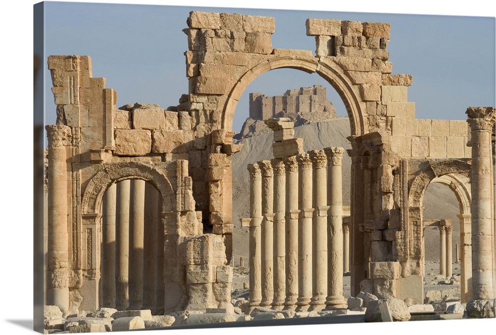 Qala'at ibn Maan castle seen through monumental arch, Palmyra, Syria
