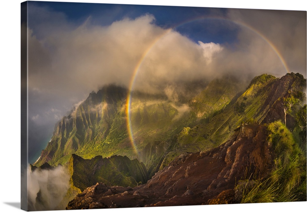 A 180 degree rainbow formed by the clouds over the Kalalau Valley on Kauai's west coast in the evening, Napali Coast State...