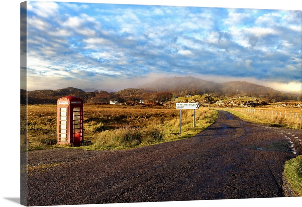 Autumn view of a red telephone box at the side of a quiet road in the remote misty Ardnamurchan moors of the Scottish High...