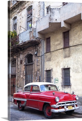 Red vintage American car parked on a street in Havana Centro, Havana, Cuba
