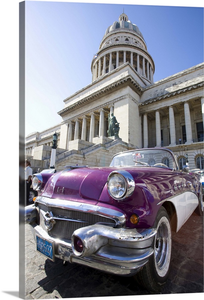 Restored classic American car parked outside The Capitilio, Havana, Cuba, West Indies