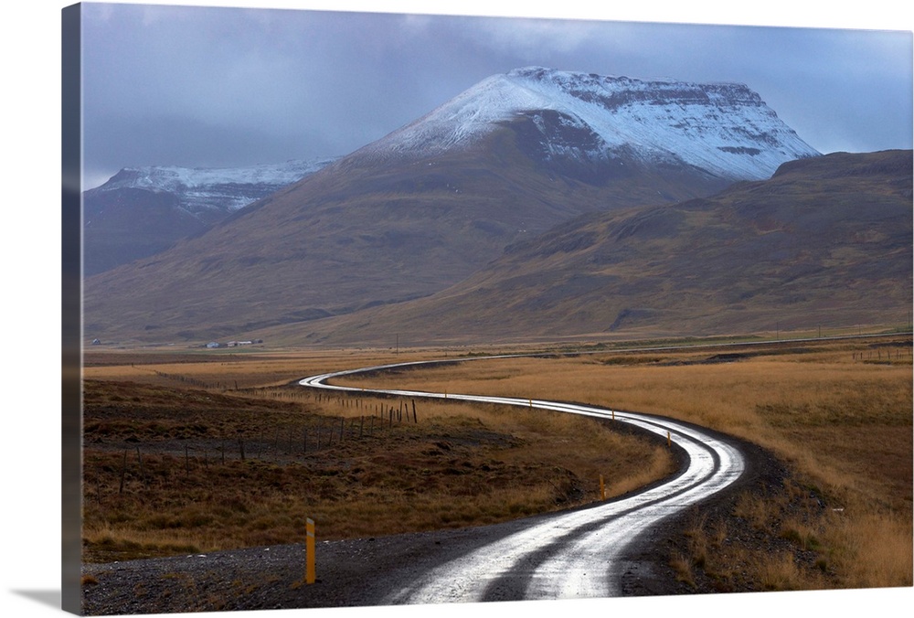 Road and landscape in Vatsnes Peninsula, with snow-covered mountains in October, north coast of Iceland, Iceland