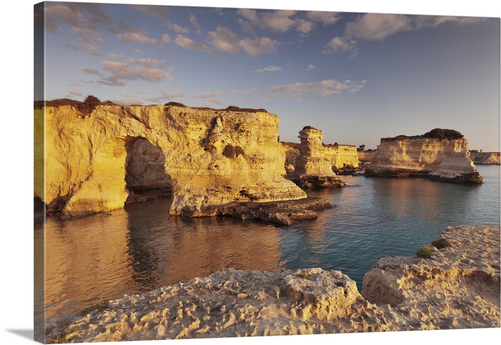 Rocky columns, natural monument, rocky coast at sunrise , Sant'Andrea, Adriatic Sea, Lecce province, Salentine Peninsula, ...