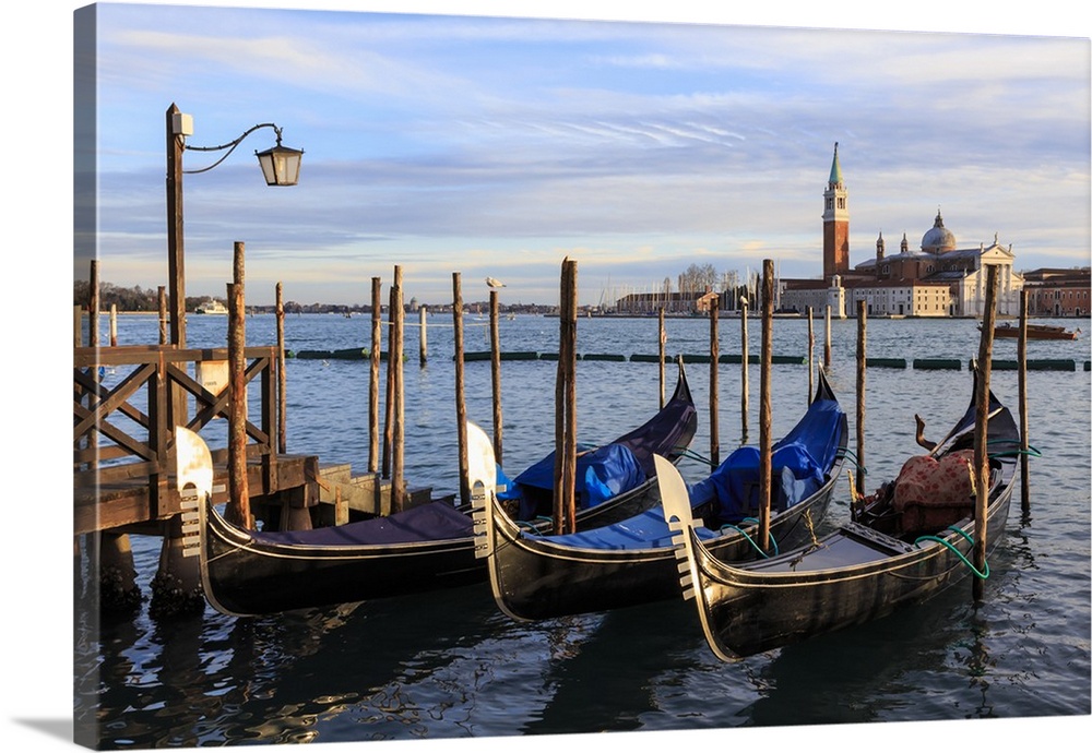 Gondolas, San Marco waterfront at sunset in winter, view to San Giorgio Maggiore, Venice, Veneto, Italy