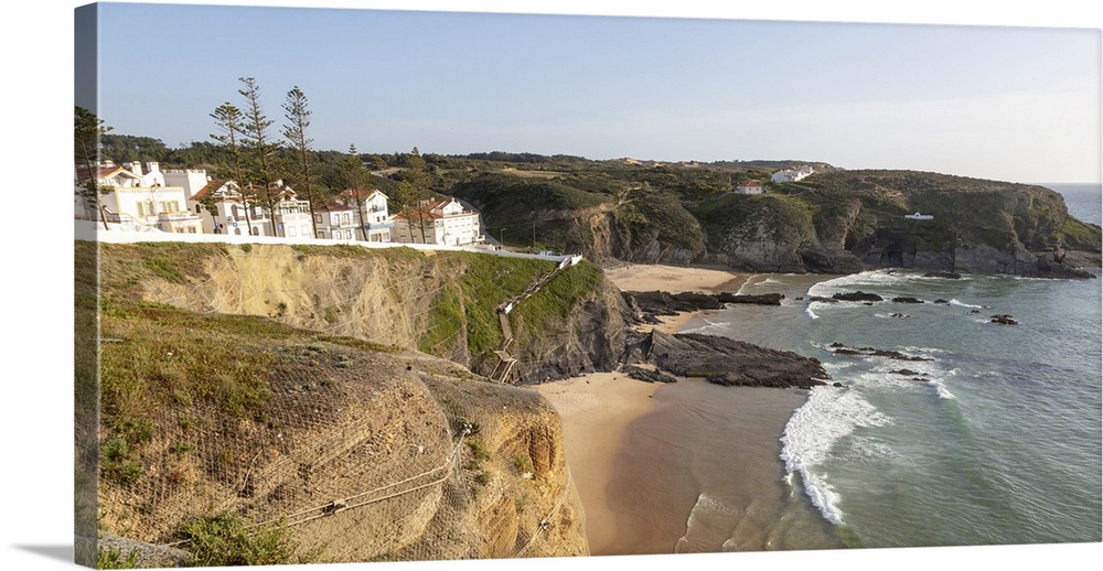 Sandy beach in bay between rocky headlands part of Parque Natural do Sudoeste Alentejano e Costa Vicentina, Zambujeira do ...