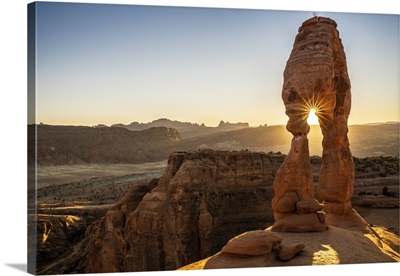 Setting Sun Through Delicate Arch With Sunburst, Arches National Park, Utah
