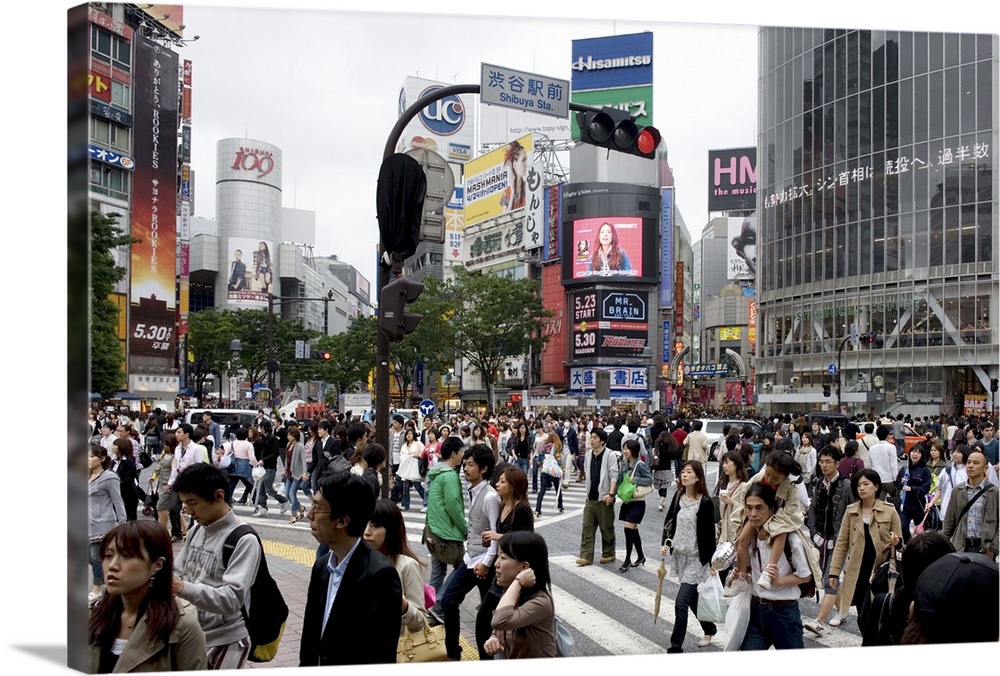 Shibuya crossing in front of the Shibuya train station, Tokyo, Japan