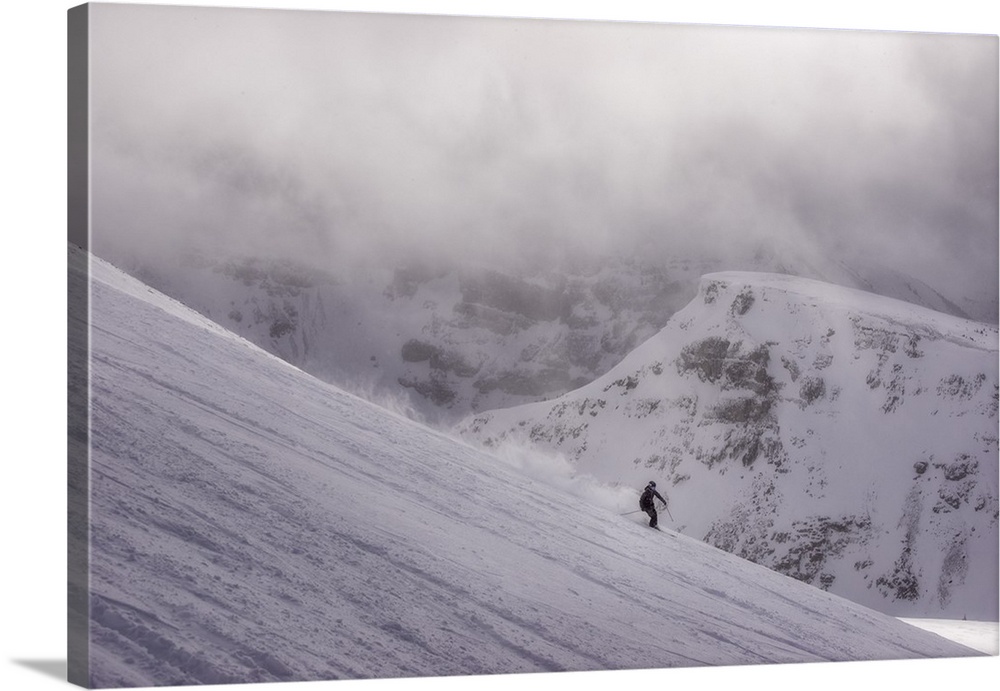 Skier in the mountains on a magical looking day, Canada