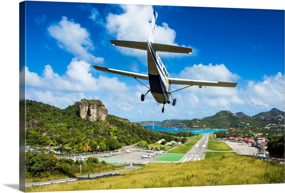 Small airplane landing at the airport of St. Barth, Lesser Antilles, West Indies, Caribbean