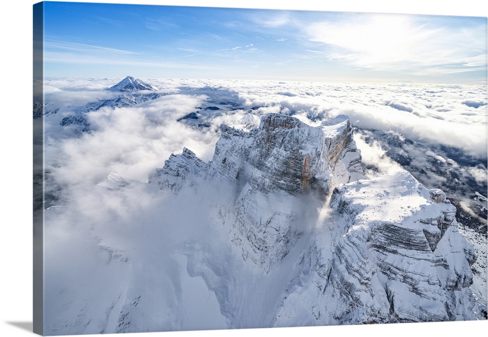 Snow capped Monte Pelmo emerging from clouds, aerial view, Dolomites, Belluno province, Veneto, Italy, Europe