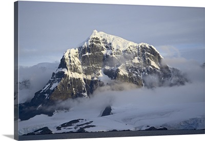 Snow covered coastal mountain, Wiencke Island, Antarctica