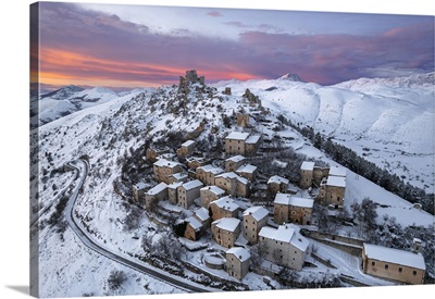 Snow Covered Medieval Village Of Rocca Calascio With The Castle And Pink Clouds, Italy
