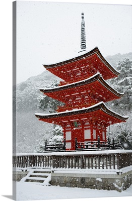 Snow falling on small red pagoda, Kiyomizu-dera Temple, Kyoto, Japan