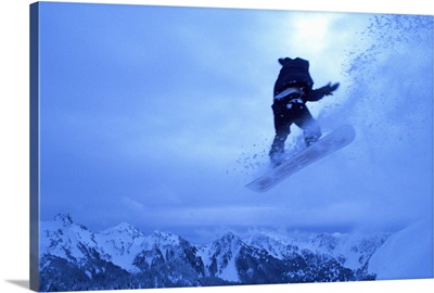 Snowboarder heads down, Paradise area, Mount Rainier, Washington State