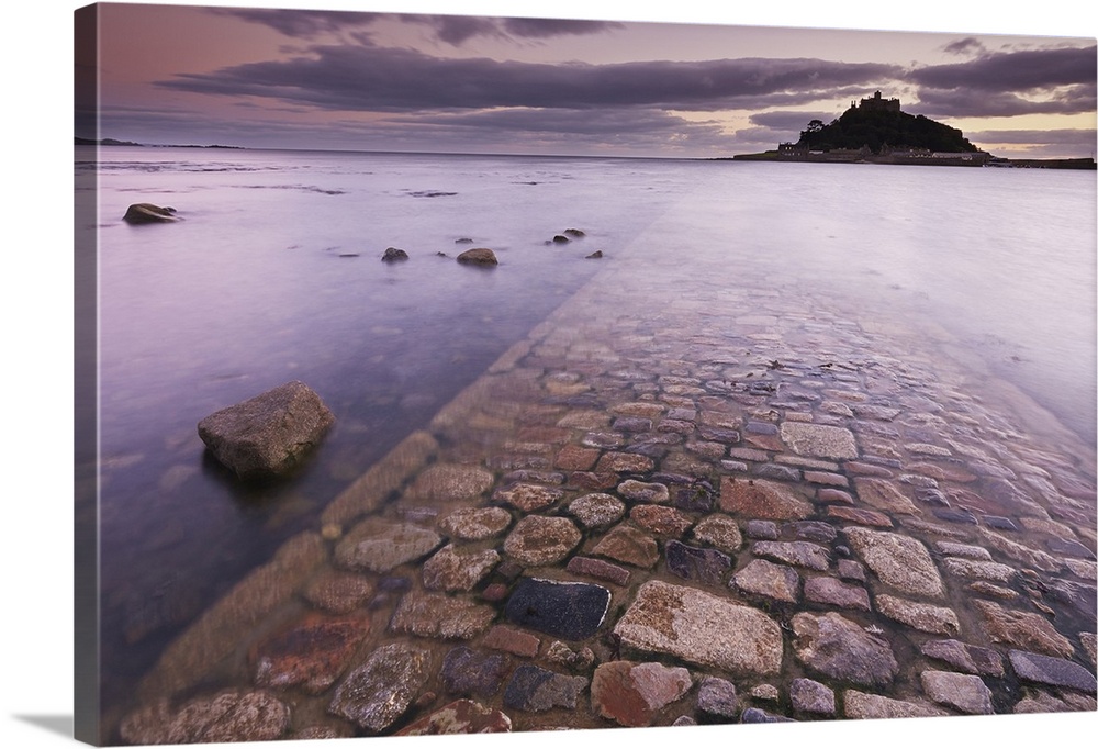 A dusk view of St. Michael's Mount, one of Cornwall's most iconic landmarks, in Marazion, near Penzance, in west Cornwall,...